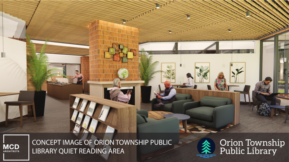Quiet reading area with art wall, fireplace, and public seating.