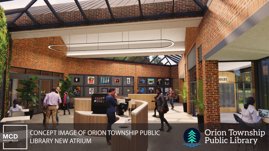 Atrium with art wall, public coffee machine, and skylights.